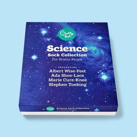 Set of four science socks featuring Albert Wise-Feet, Ada Shoe-Lace, Marie Cure-Knee, and Stephen Toeking in gift packaging